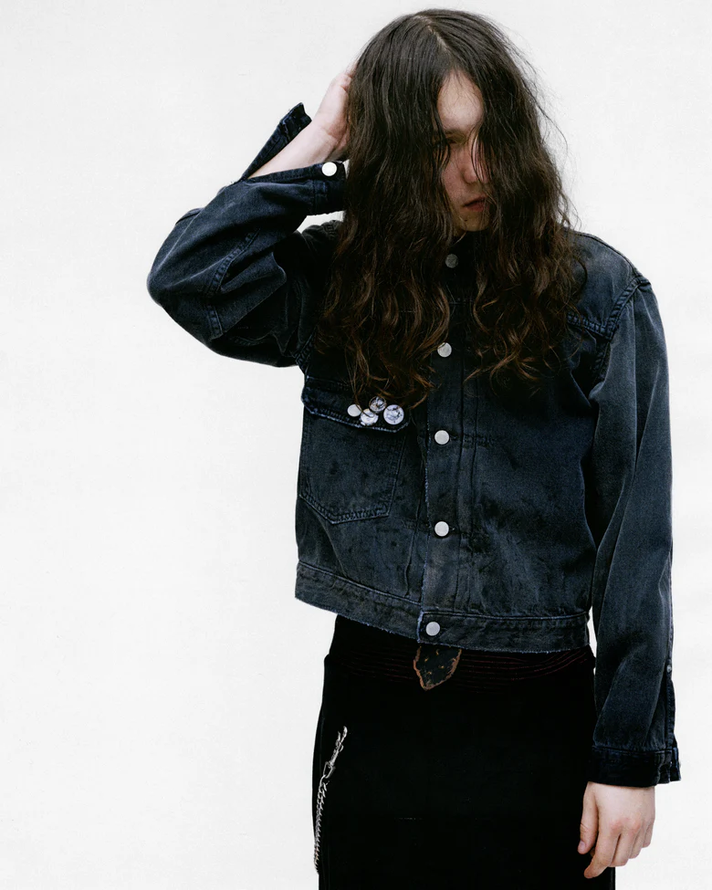 Grey jacket worn by a person, showing the jacket's fit