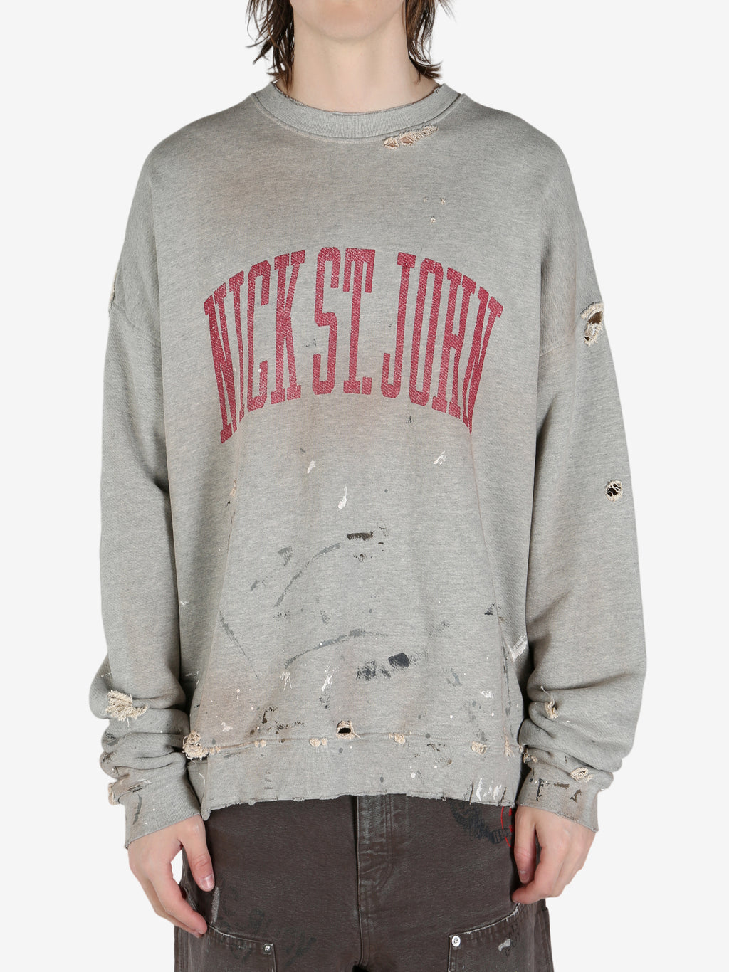 Grey sweatshirt worn by a person, showing the shirt's fit
