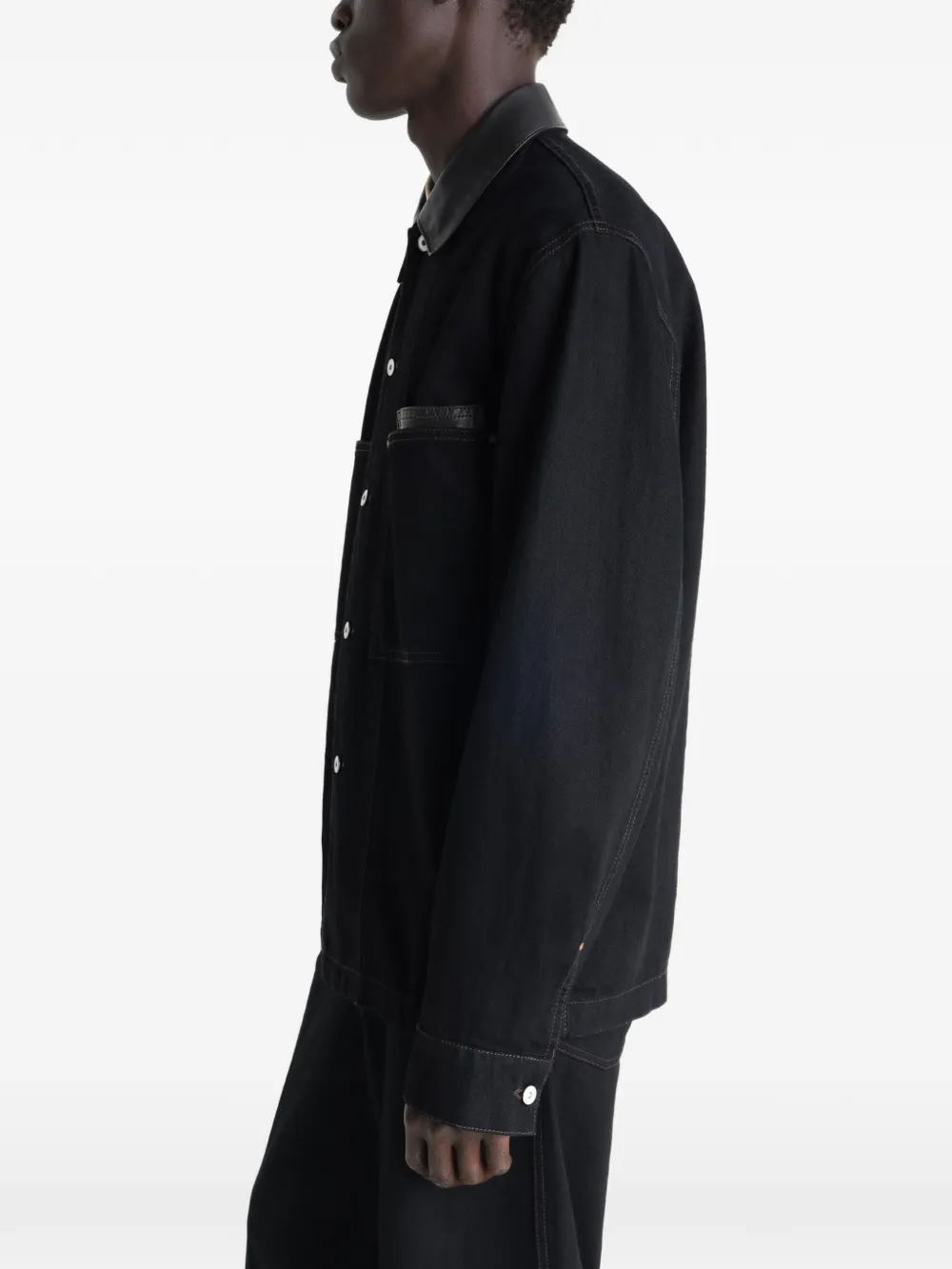 Black jacket worn by a person, showing the jacket's fit