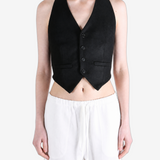 Black top worn by a person, showing the top fit