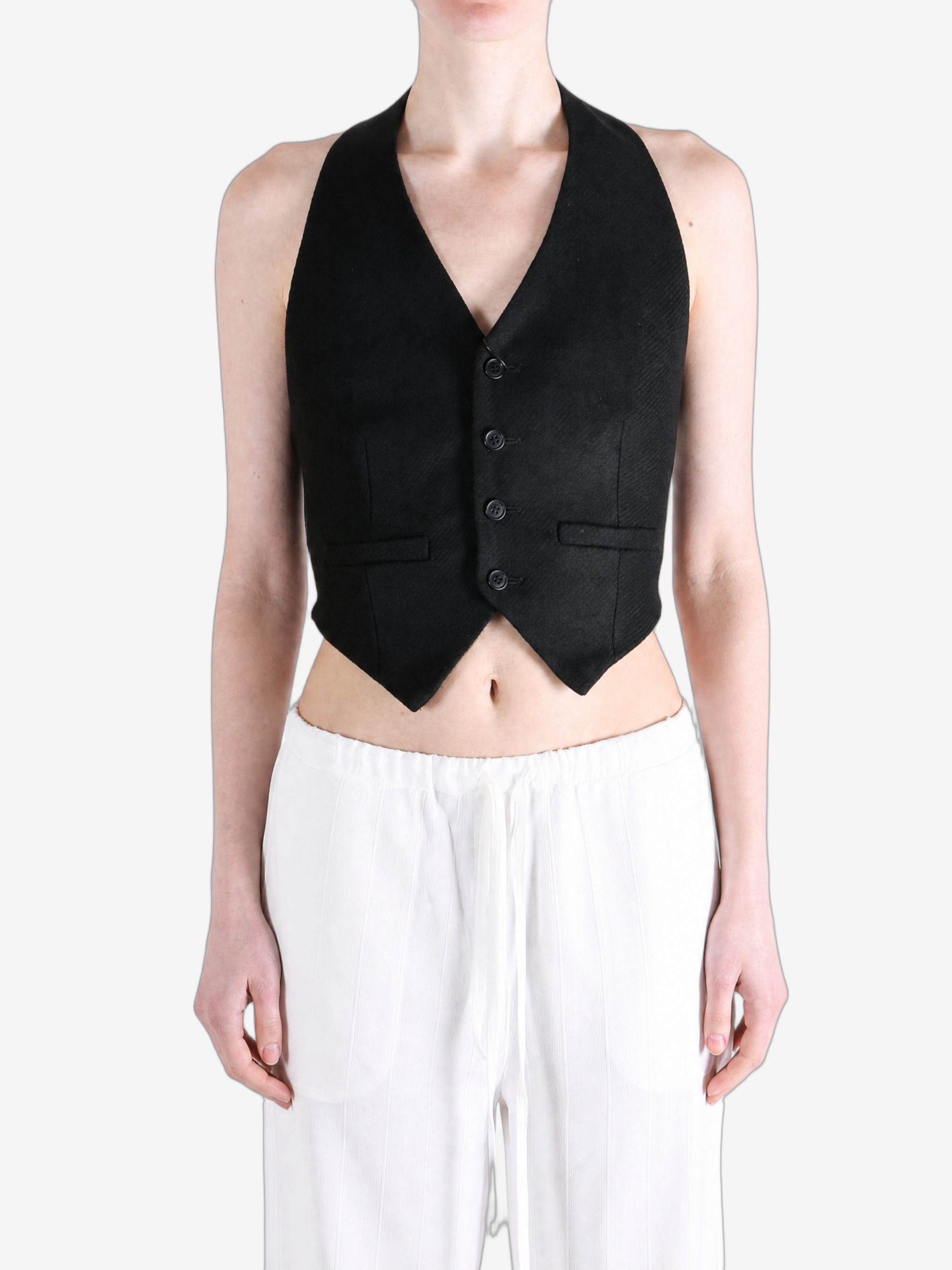Black top worn by a person, showing the top fit