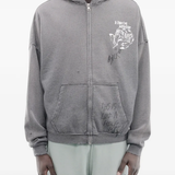 Grey hoodie worn by a person, showing the hoodie's fit