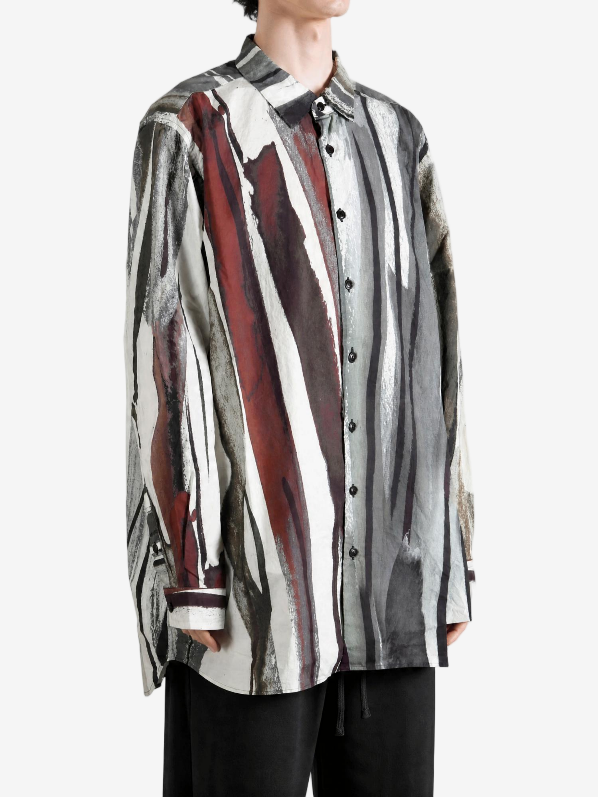 Grey shirt worn by a person, showing the shirt fit