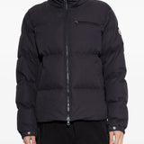Black jacket worn by a person, showing the jacket fit