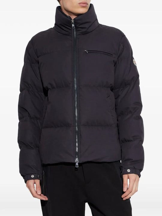 Black jacket worn by a person, showing the jacket fit