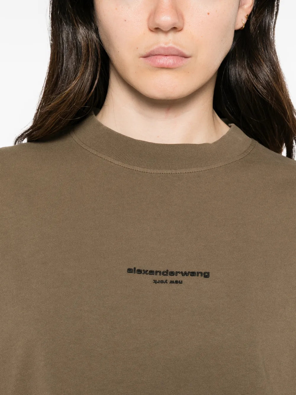 Brown top worn by a person, showing the top fit