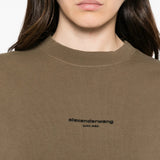 Brown top worn by a person, showing the top fit
