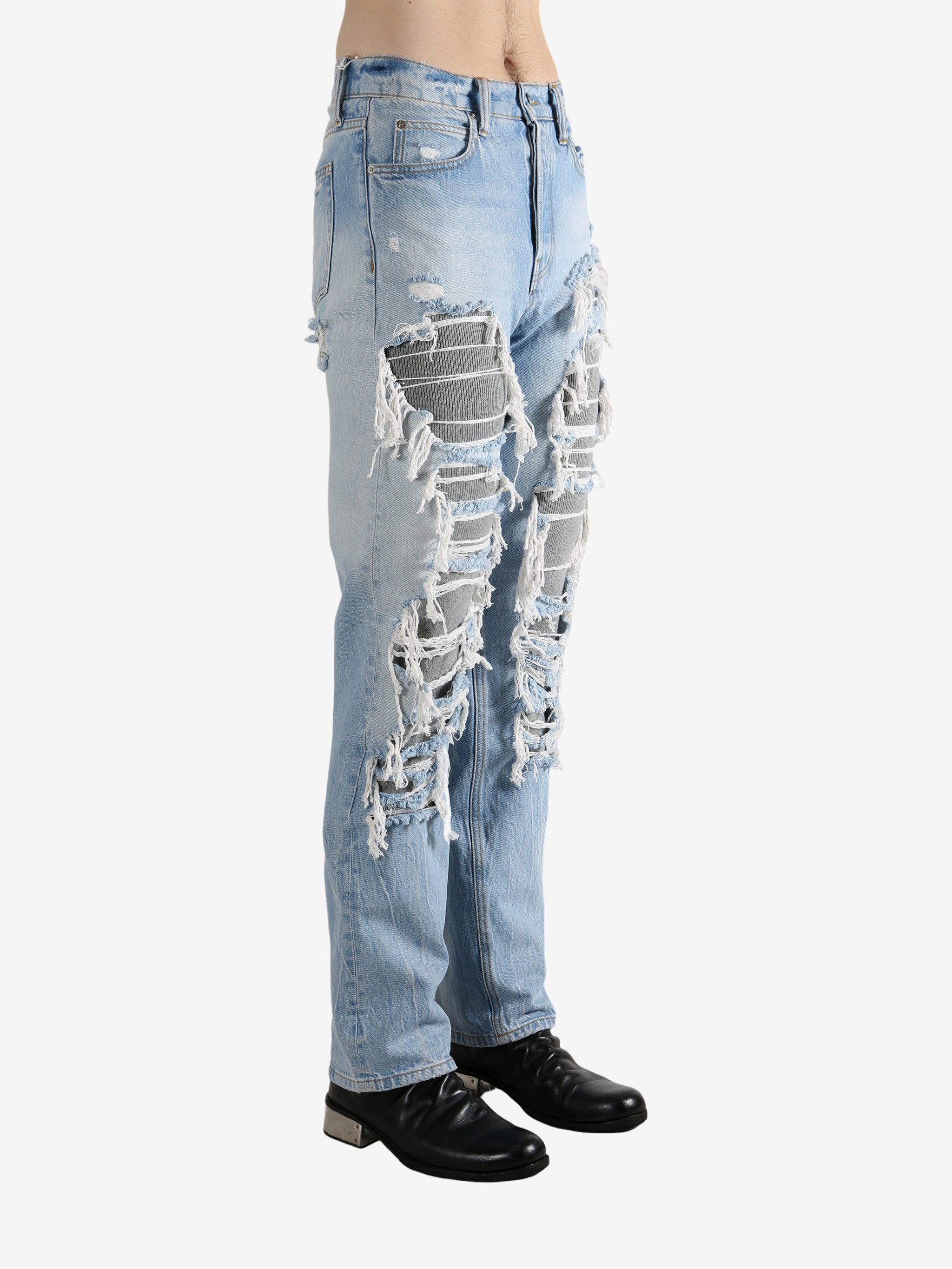 Blue jeans worn by a person, showing the jeans fit