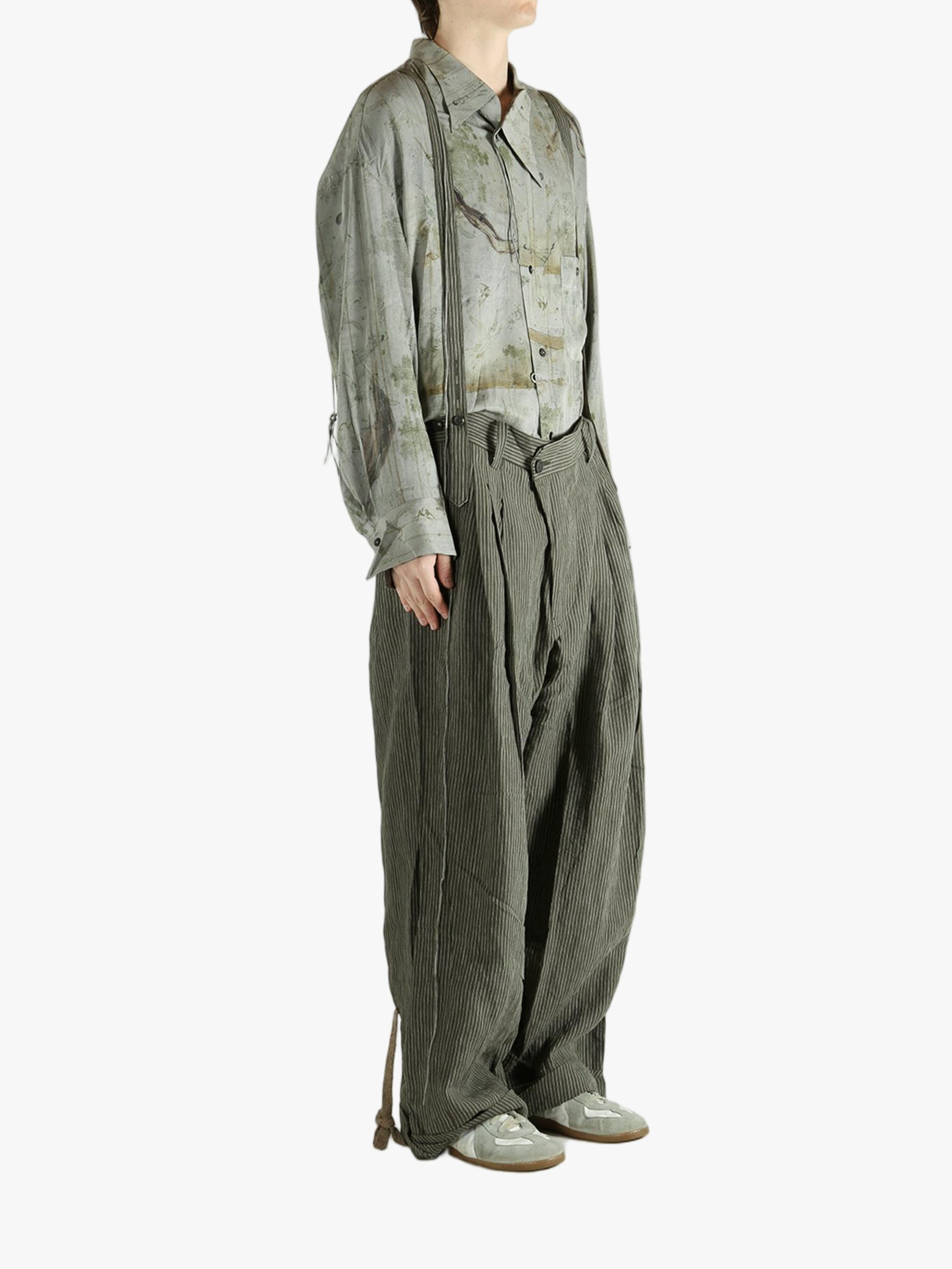 Green pants worn by a person, showing the pants's fit