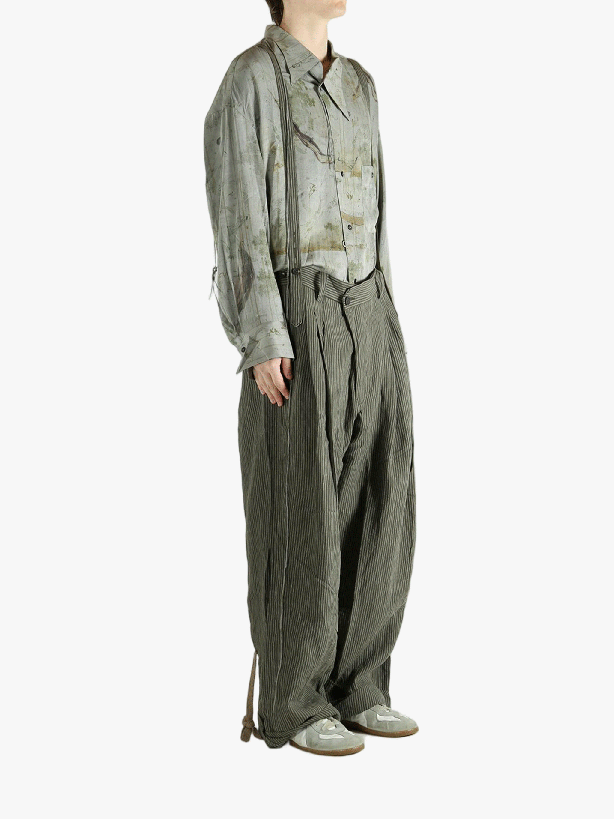 Green pants worn by a person, showing the pants's fit