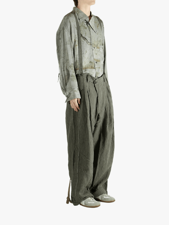 Green pants worn by a person, showing the pants's fit