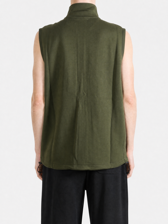 Green knitwear worn by a person, showing the knitwear fit