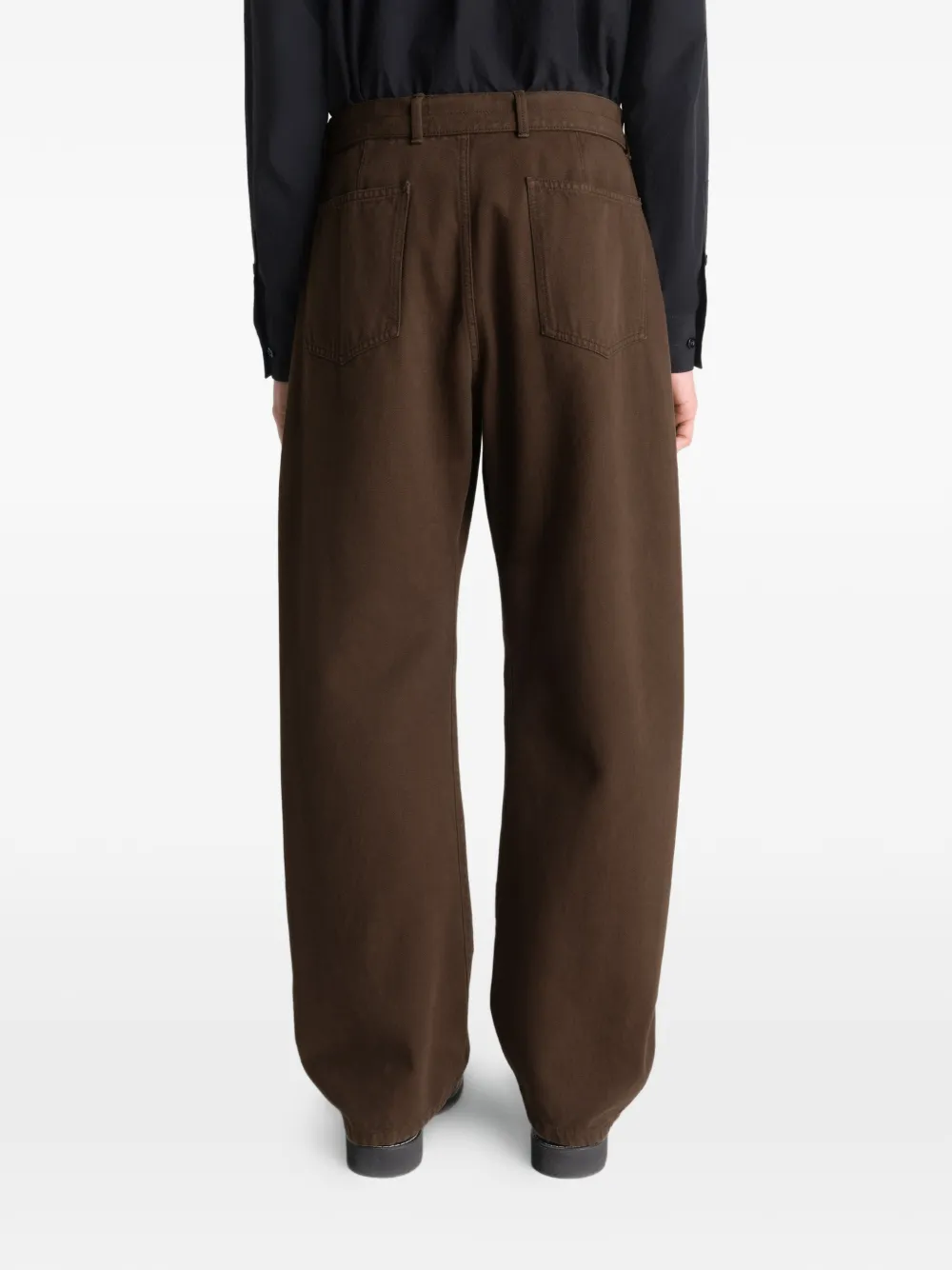 Brown pants worn by a person, showing the pants fit