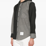 Grey sweater worn by a person, showing the sweater's fit