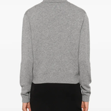 grey shirt worn by a person, showing the shirt fit