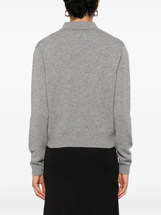 grey shirt worn by a person, showing the shirt fit