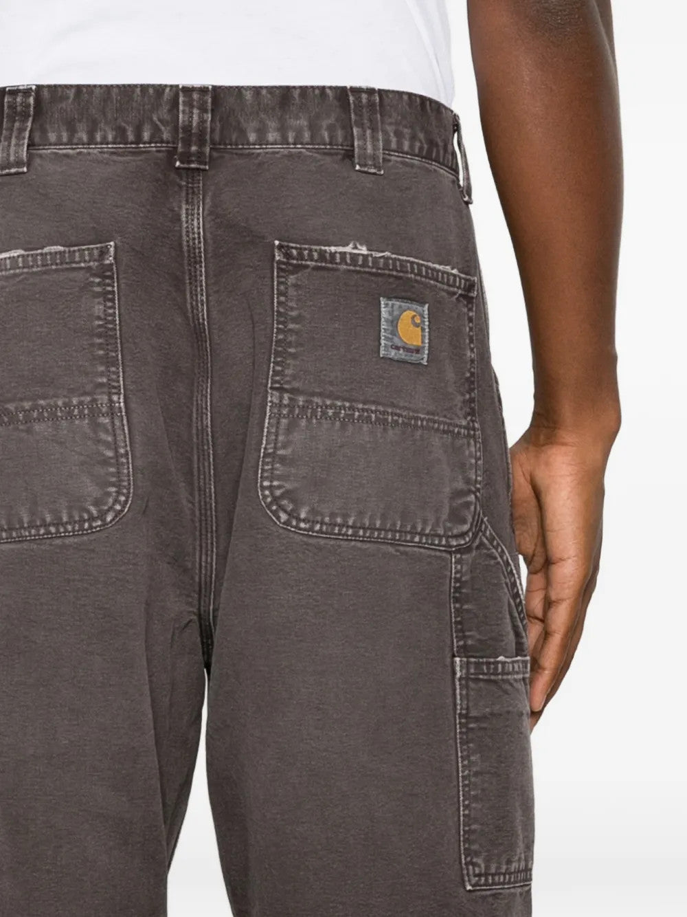 Brown pants worn by a person, showing the pants fit