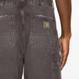 Brown pants worn by a person, showing the pants fit