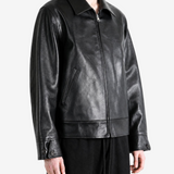 Black jacket worn by a person, showing the jacket fit