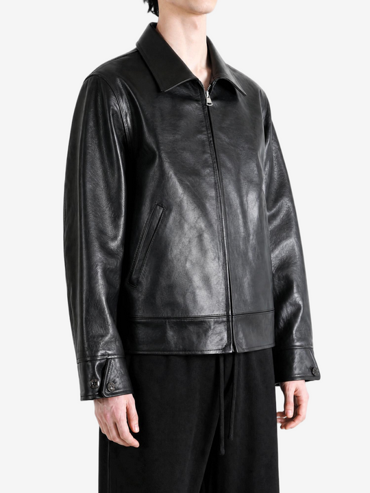 Black jacket worn by a person, showing the jacket fit