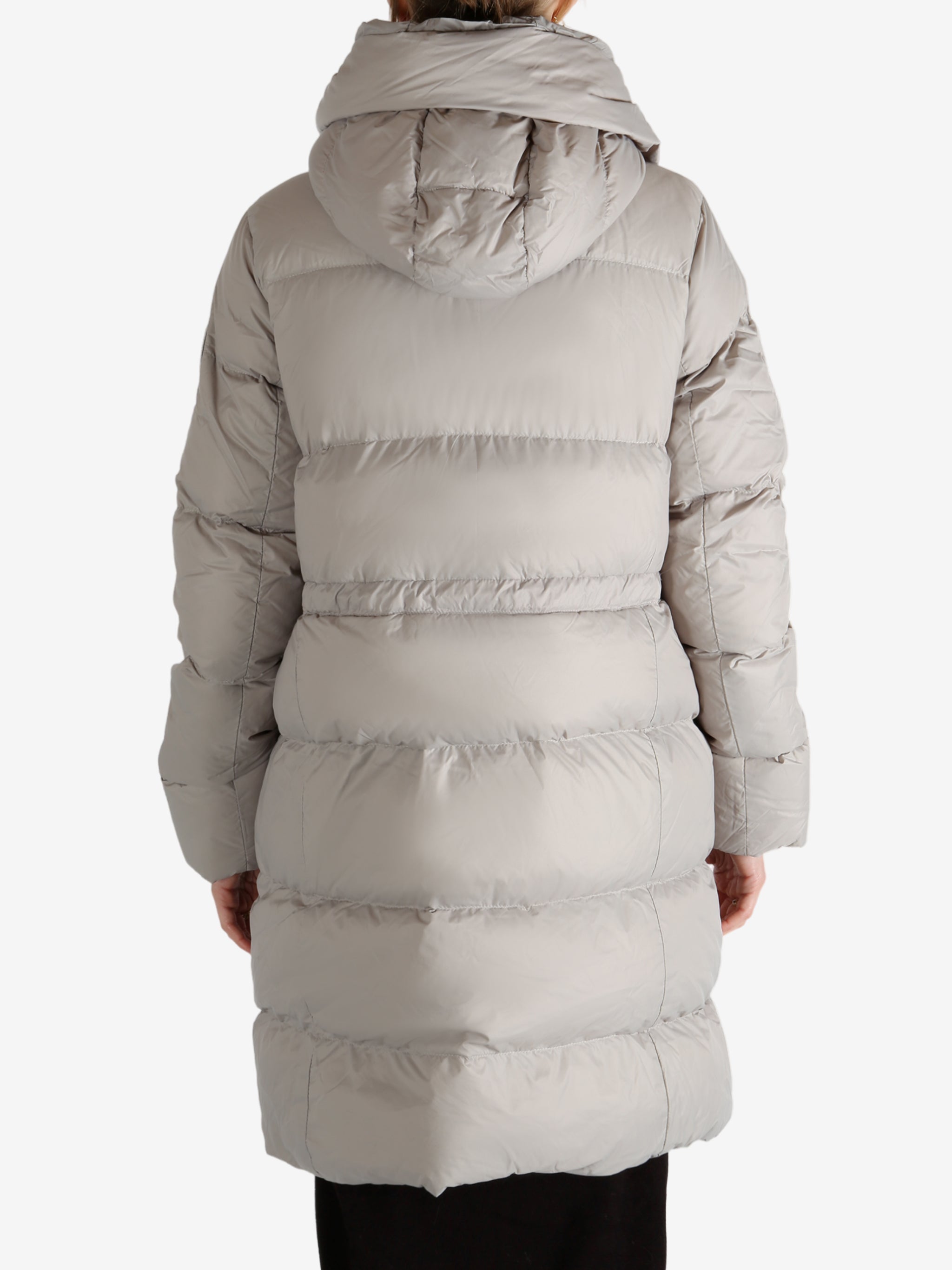 Grey coat worn by a person, showing the coat fit