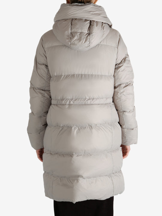 Grey coat worn by a person, showing the coat fit