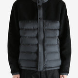 Black jackets worn by a person, showing the jackets fit