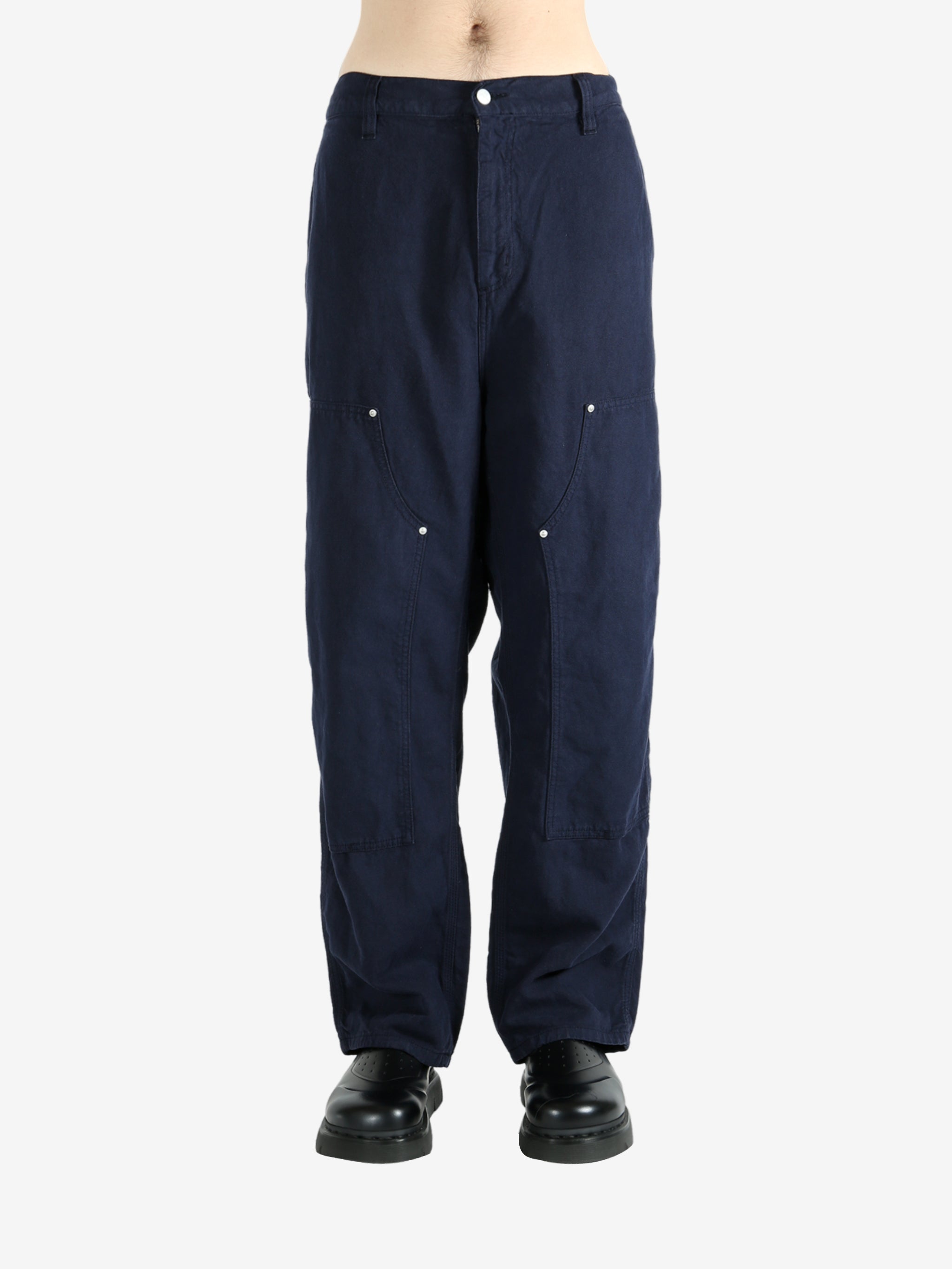 Blue pants worn by a person, showing the pants's fit