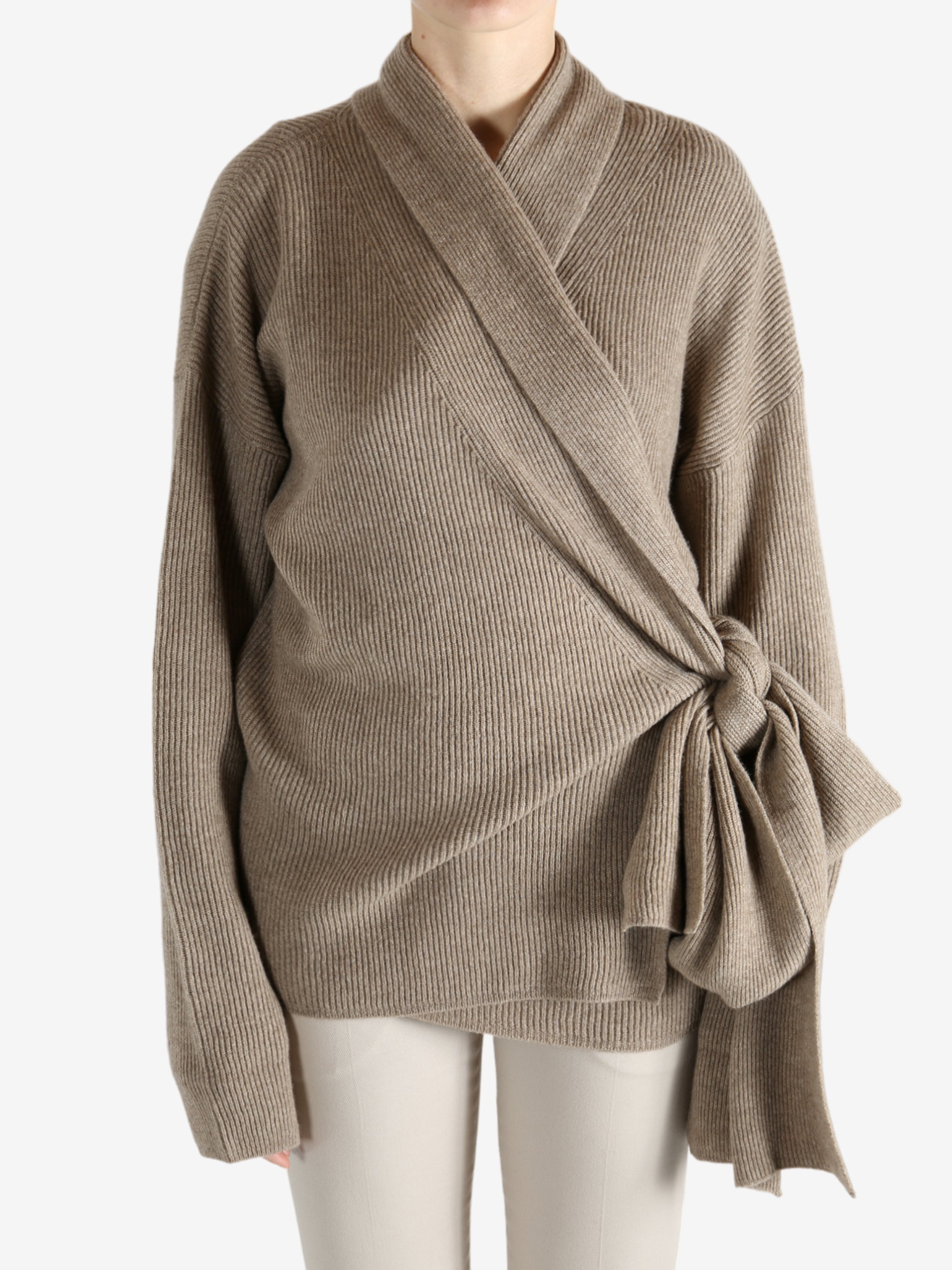 Tan cardigan worn by a person, showing the cardigan's fit