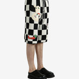 Black shorts worn by a person, showing the shorts’ fit