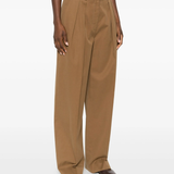 Yellow pant  worn by a person, showing the pant's fit