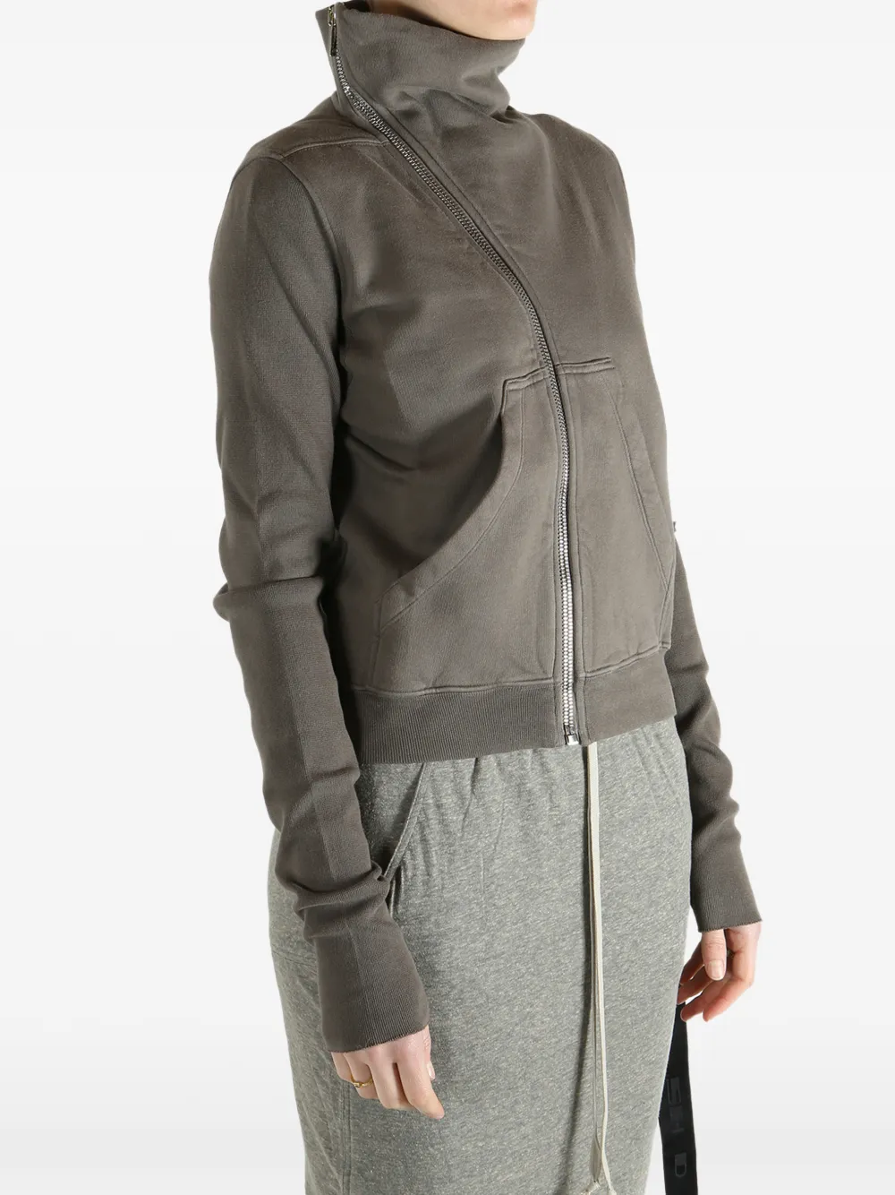 Grey sweat worn by a person, showing the sweat fit