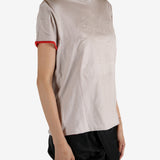 White t-shirt worn by a person, showing the shirt's fit