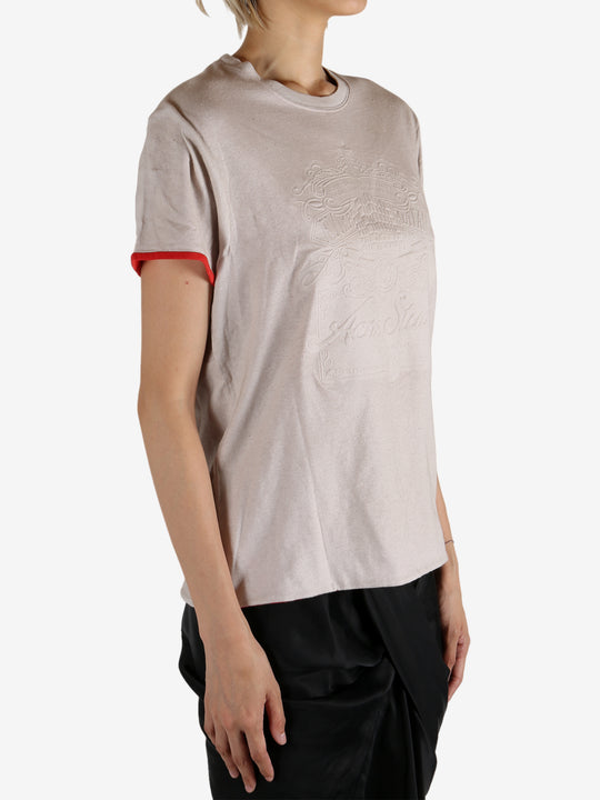 White t-shirt worn by a person, showing the shirt's fit