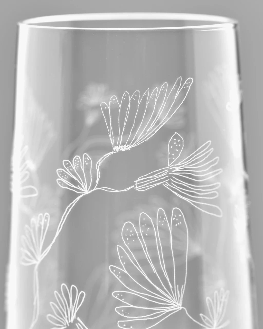 Close up of white glasses, showing texture of the glass fabric