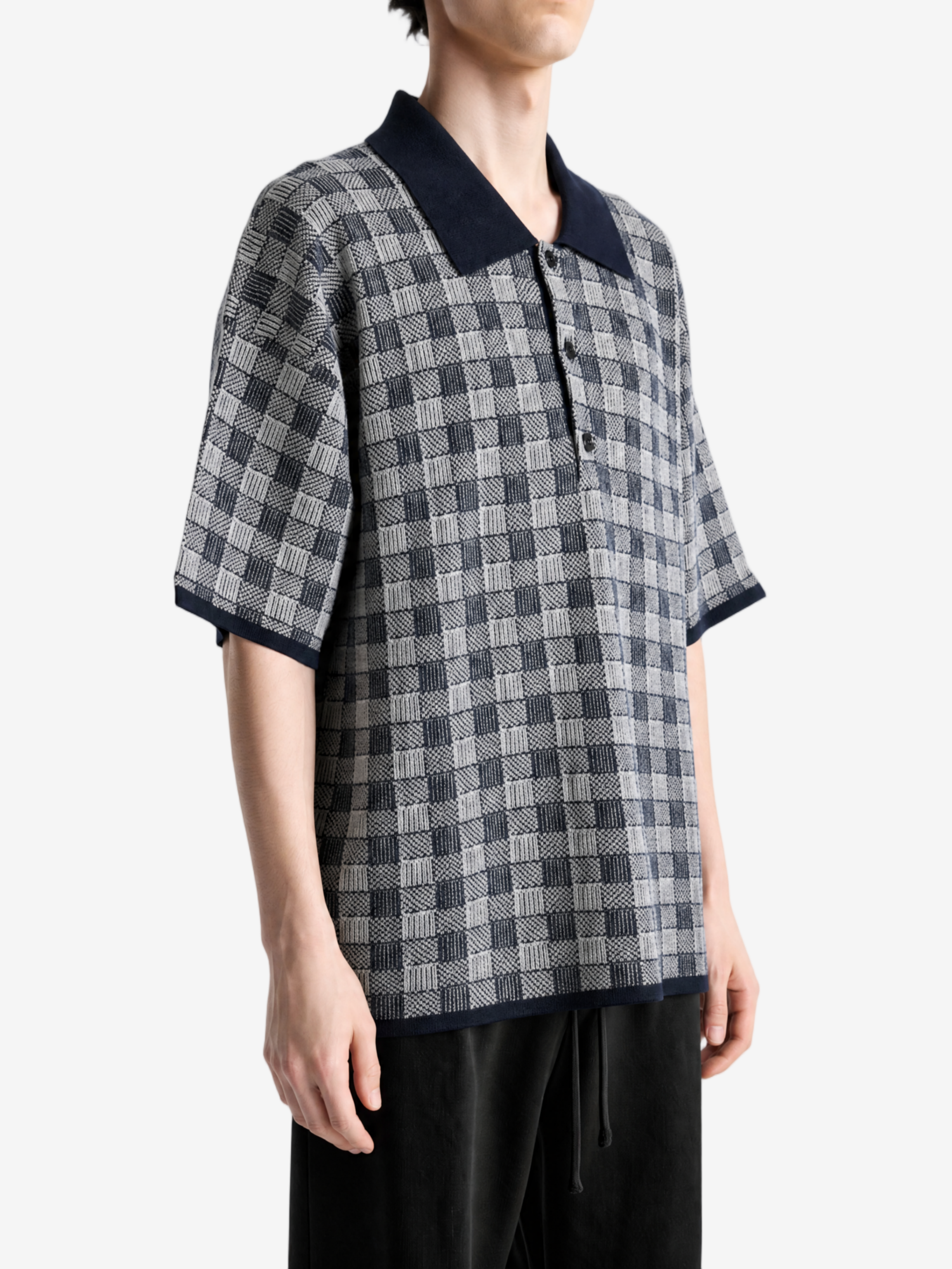 Navy shirt worn by a person, showing the shirt fit