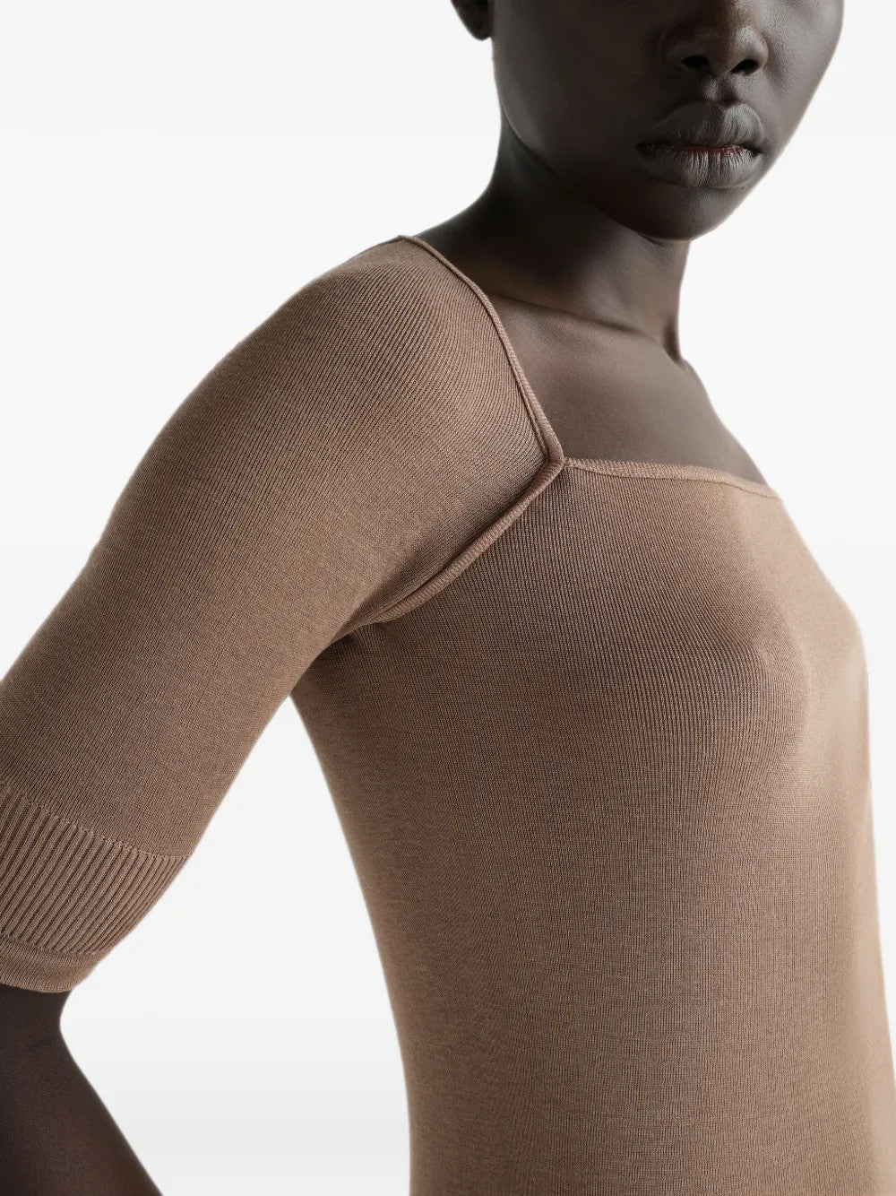 Tan top worn by a person, showing the top fit