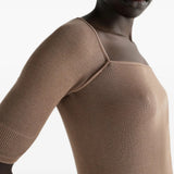 Tan top worn by a person, showing the top fit