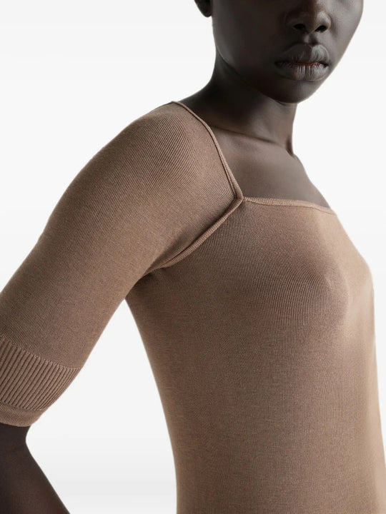 Tan top worn by a person, showing the top fit