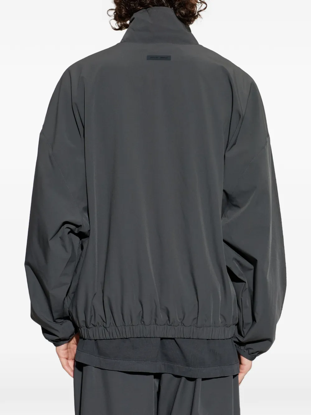 grey jacket worn by a person, showing the  jacket fit