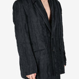 Black jacket worn by a person, showing the jacket's fit