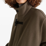 Close up of brown coats, showing texture of the cotton and wool fabric