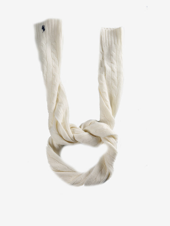 Close up of white scarves, showing texture of the cashmere and wool fabric