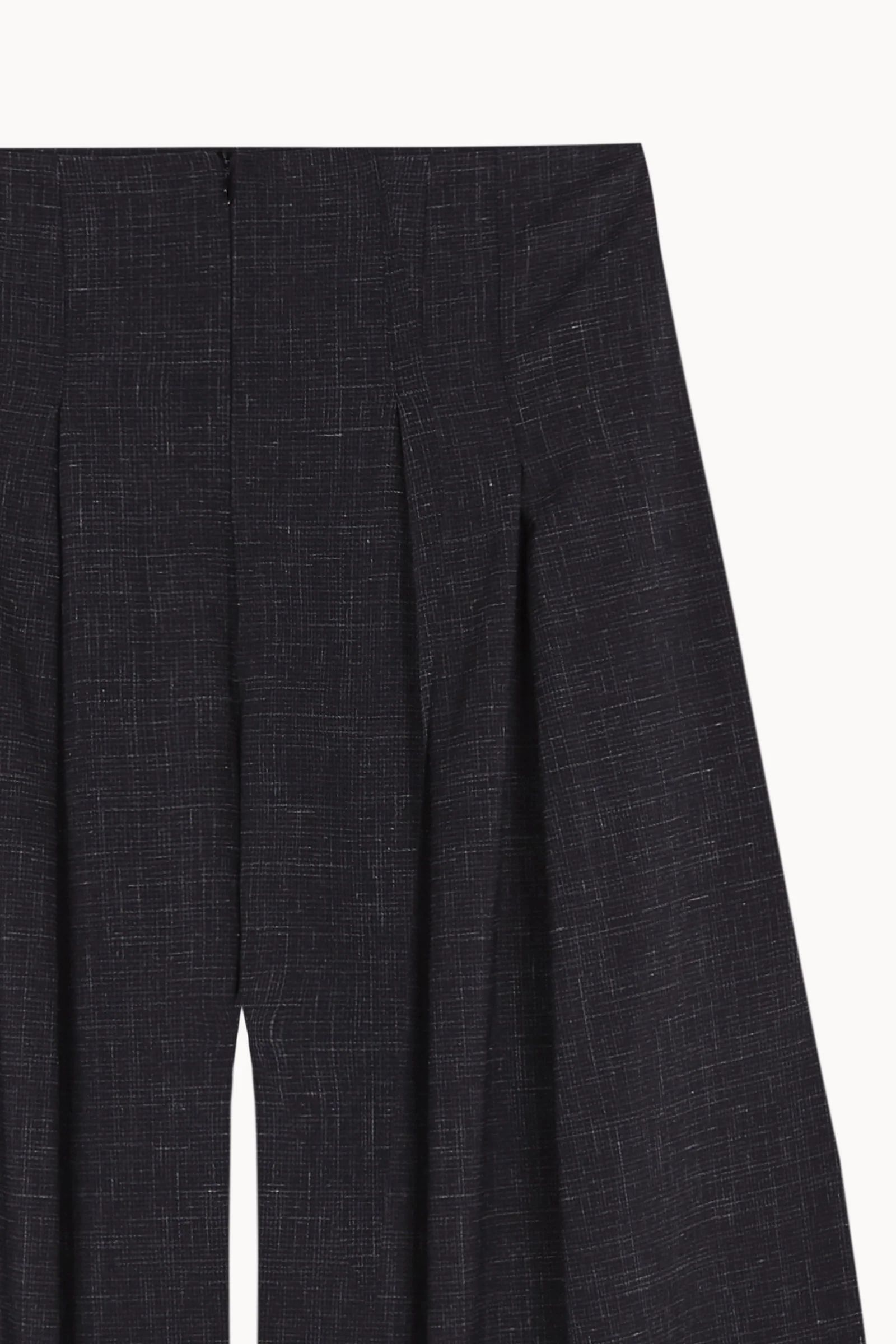 Close up of Black pants, showing texture of the 83% virgin wool/ 17% silk made in fabric