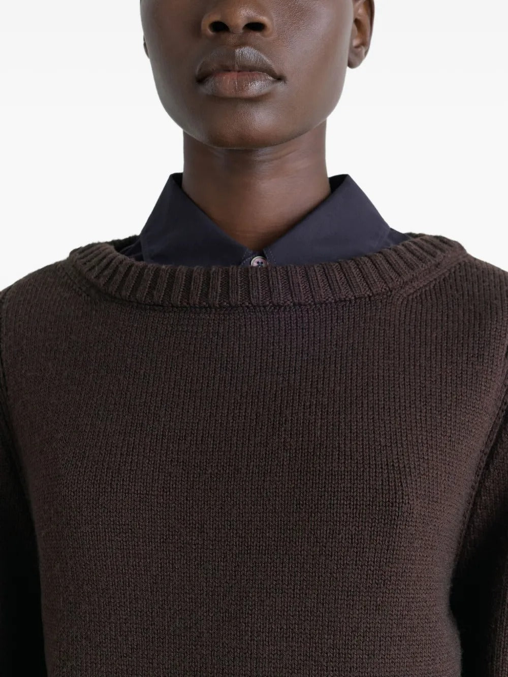 Close up of brown sweater, showing texture of the wool fabric