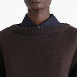 Close up of brown sweater, showing texture of the wool fabric