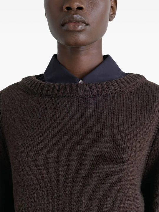 Close up of brown sweater, showing texture of the wool fabric