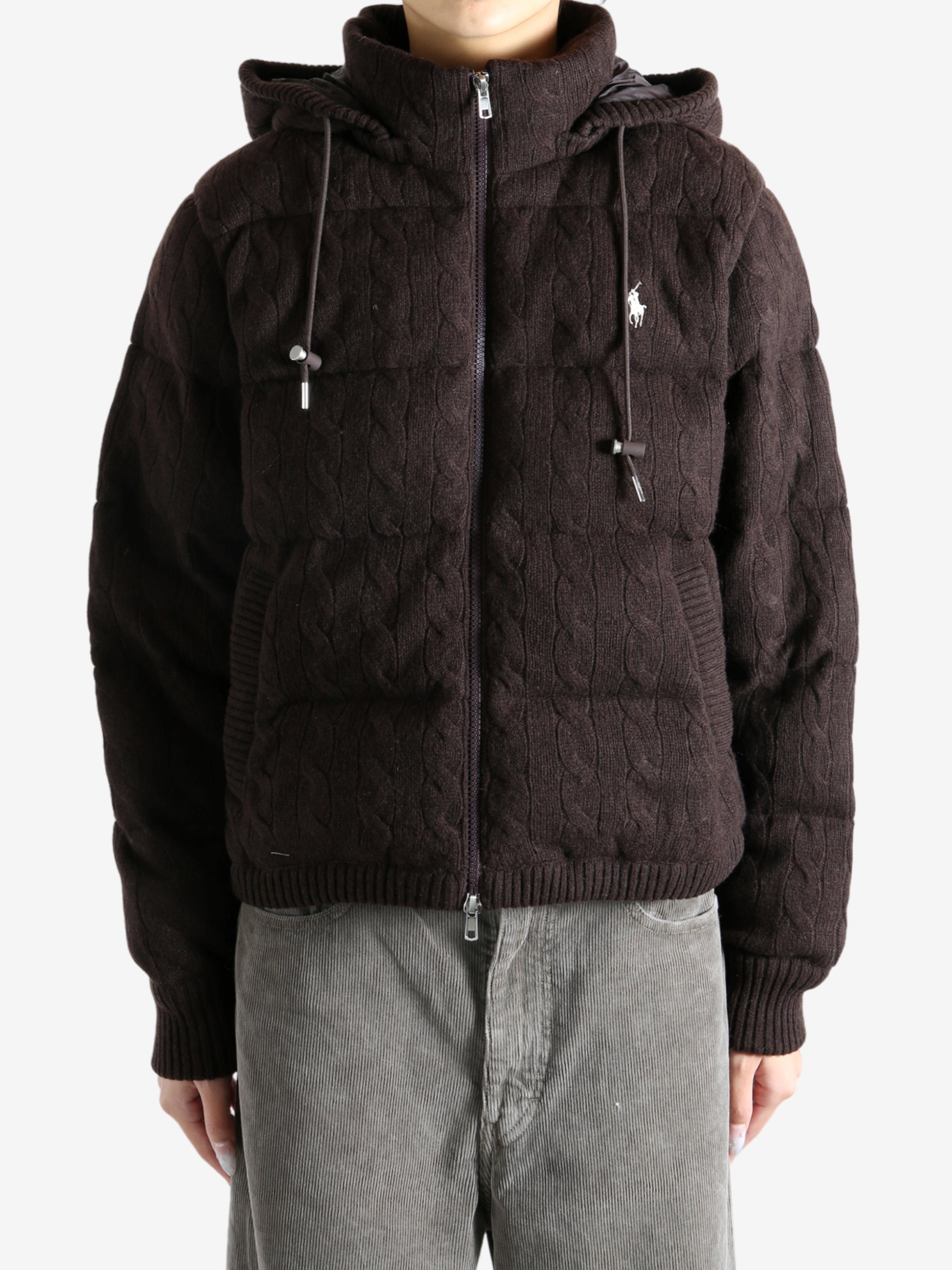 Brown coat worn by a person, showing the coat's fit