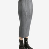 Grey skirts worn by a person, showing the skirts fit