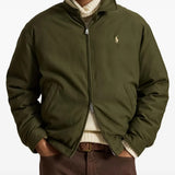 Green jacket worn by a person, showing the jacket fit
